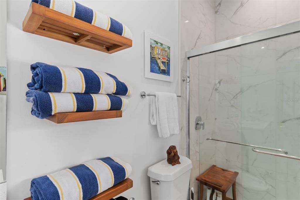 Treak wood shelving in Lanai bathroom