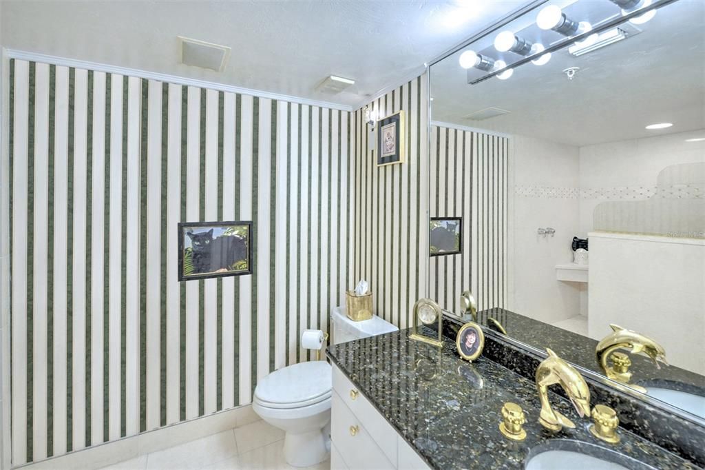 Owner's bath offers another room with separate vanity and walk in shower.