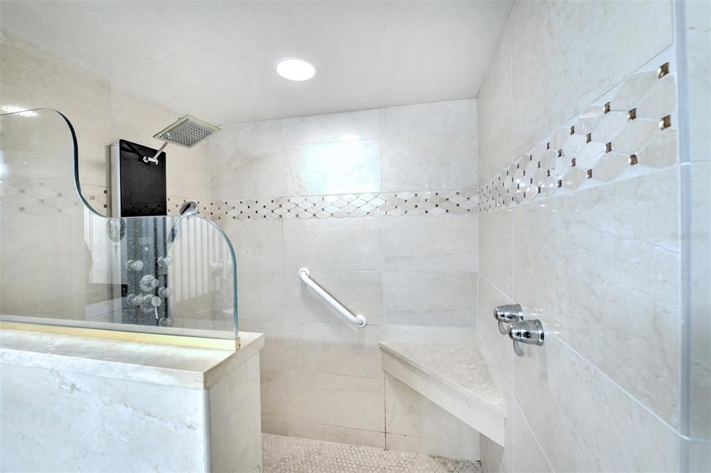 Owner's walk in shower with spray jets.