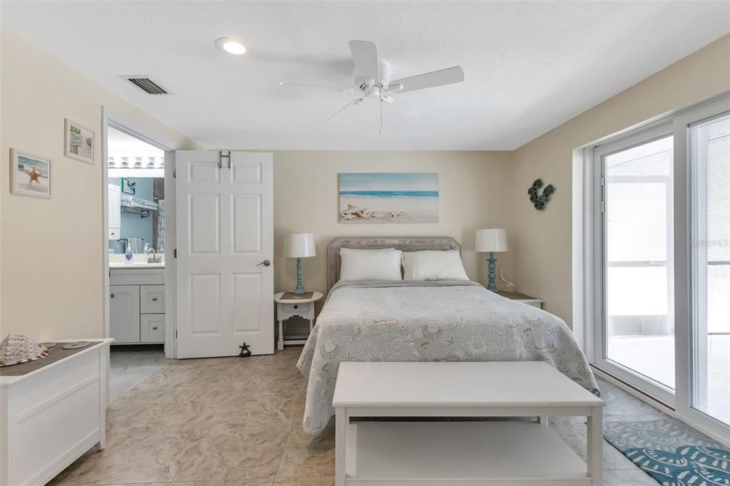 Master bedroom with Impact sliders to lanai and walk in closet.