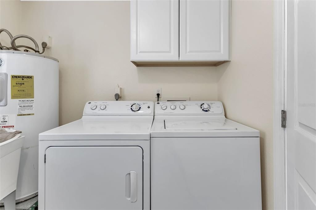 Laundry room includes washer & dryer.