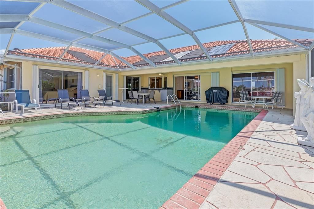 Screened lanai, oversized pool and sauna - plus covered space that provides shade, if desired.