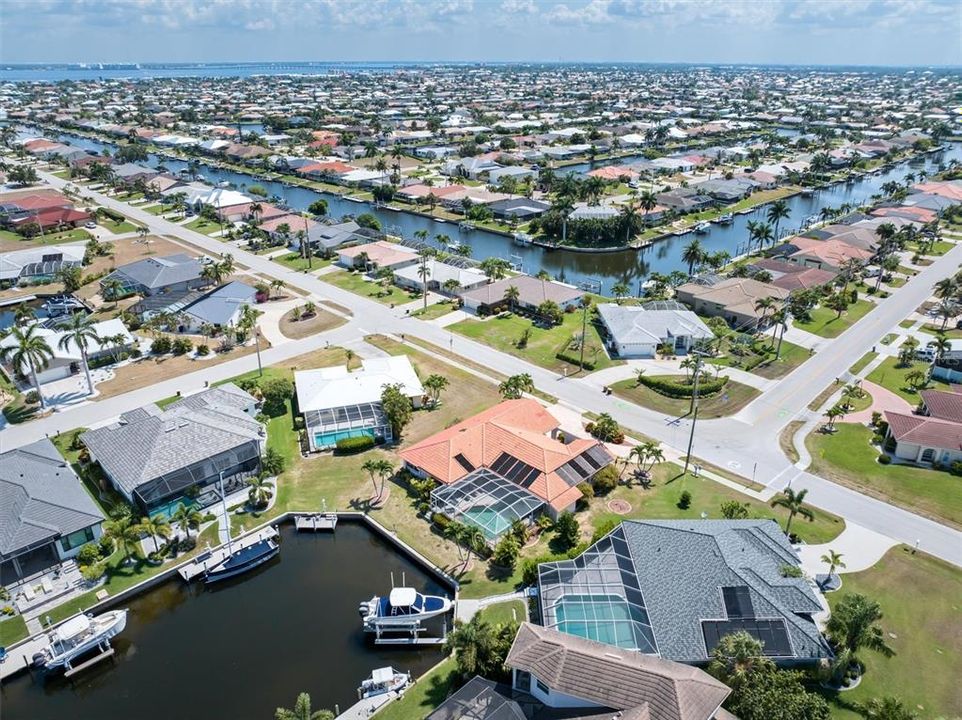 58-feet of concrete seawall and mature landscaping provide privacy and a tropical feel to this canal waterfront property.