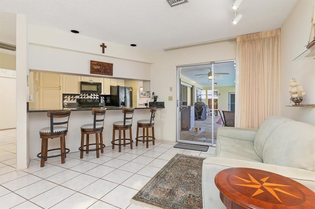 Breakfast bar extends into 28'x18' family room. Some of this space could easily be used for a bistro-type table for another dining option.