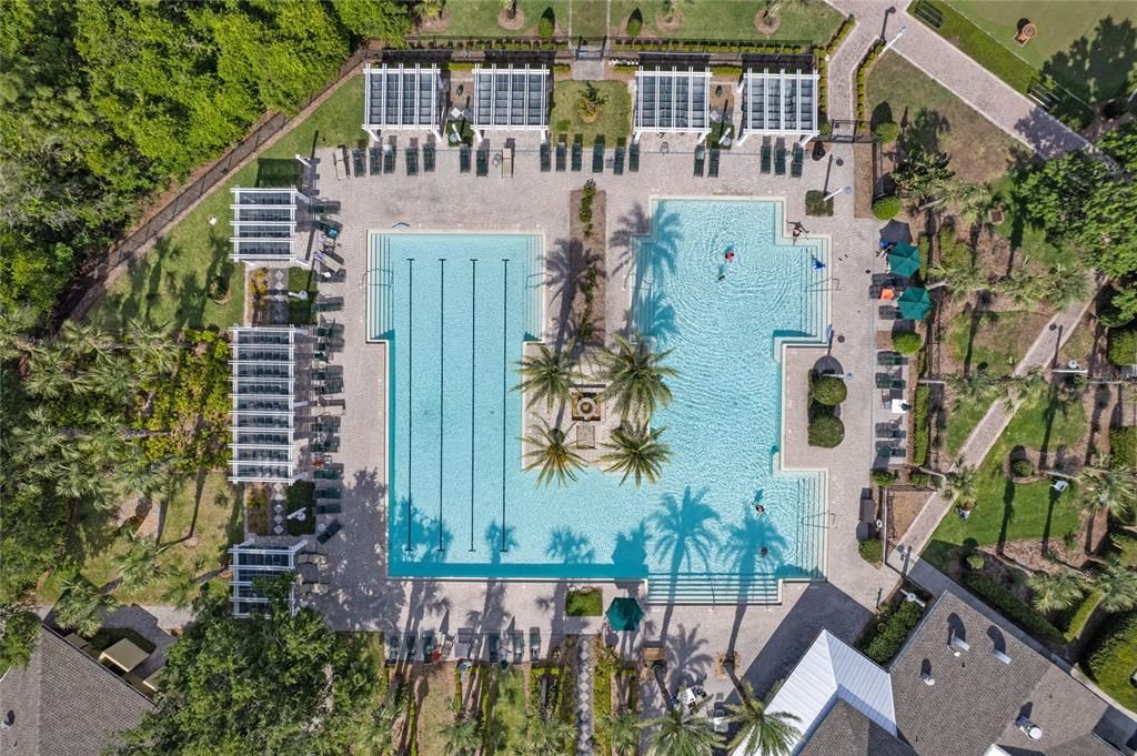 Aerial view of the Victoria Gardens resort style heated pool w/ shaded arbors