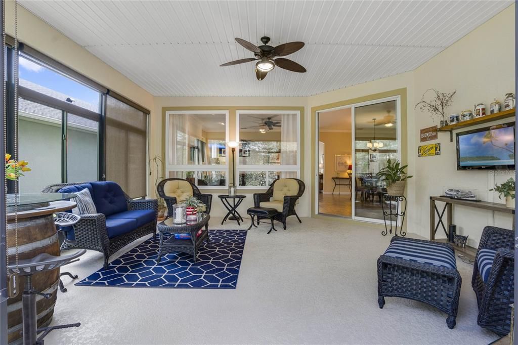 Enclosed Lanai w/ wall mounted TV & a ceiling fan