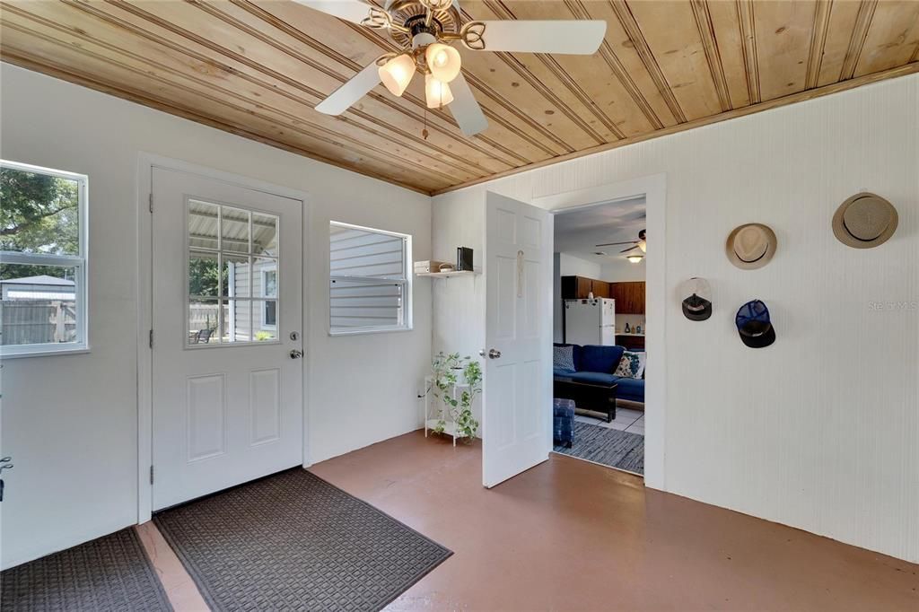 Room that separates homes, looking towards home 2 and backyard.