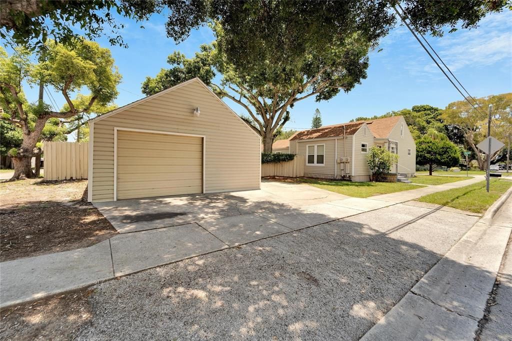 Oversized 1 car garage with multiple parking areas and alley access