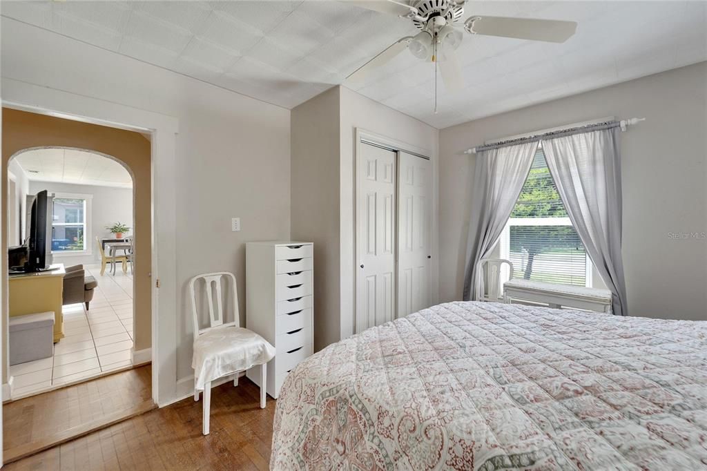 Spacious bedroom 1 with original hardwood floors