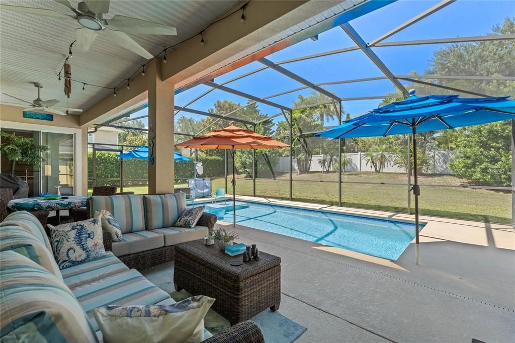 The covered lanai has lots of space for everyone for those summer parties or just enjoy your oasis on your own