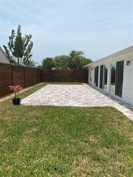 massive entertaining space in fenced in backyard