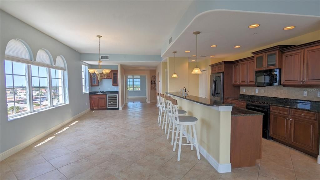 Modern, high end kitchen, and adjacent dining area.