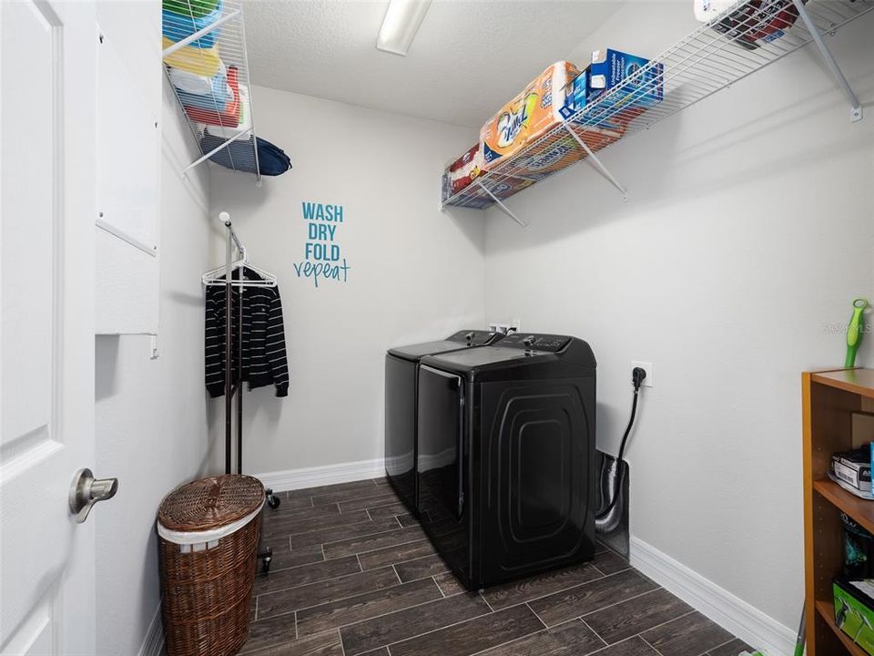 Large laundry room. Washer and dryer stay!