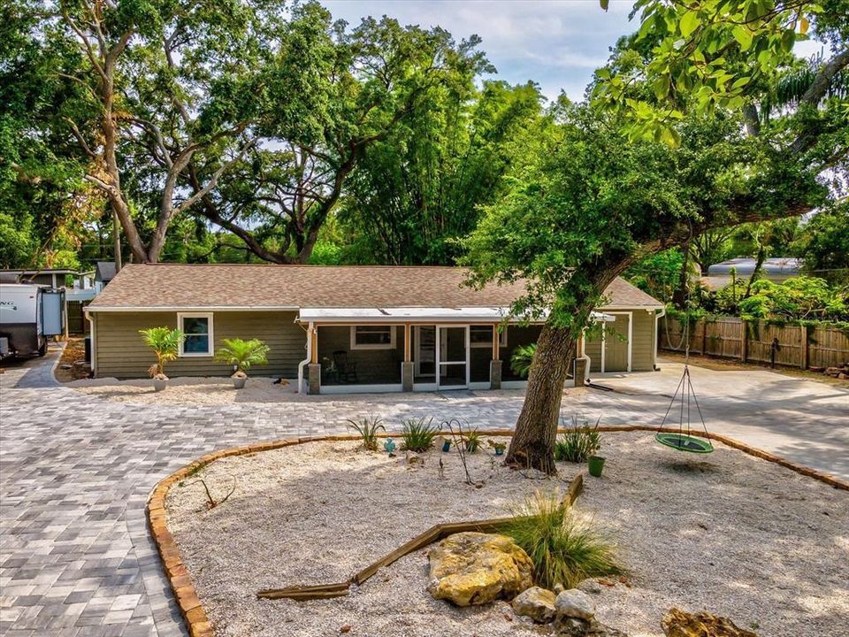 Pavers cover the circular driveway around the property.