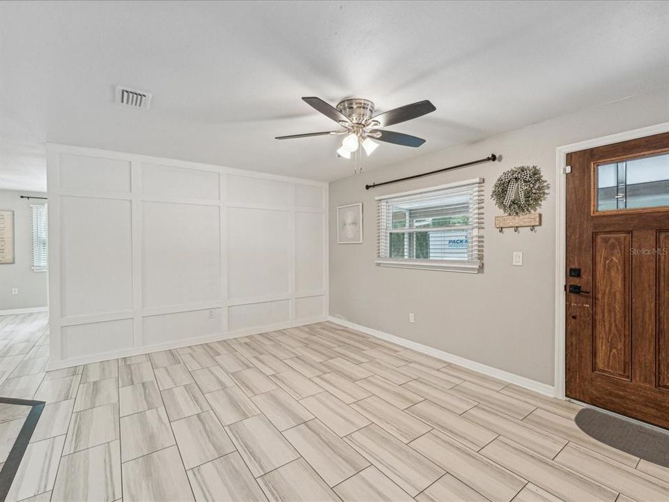 Porcelain tile floors and ceiling fans with lights can be found throughout the whole house.