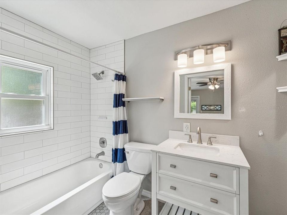 This full bathroom is right off of the kitchen nook.