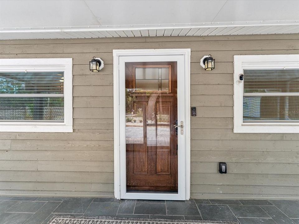 The front door was replaced in 2020 and has an exterior storm door as an added barrier.