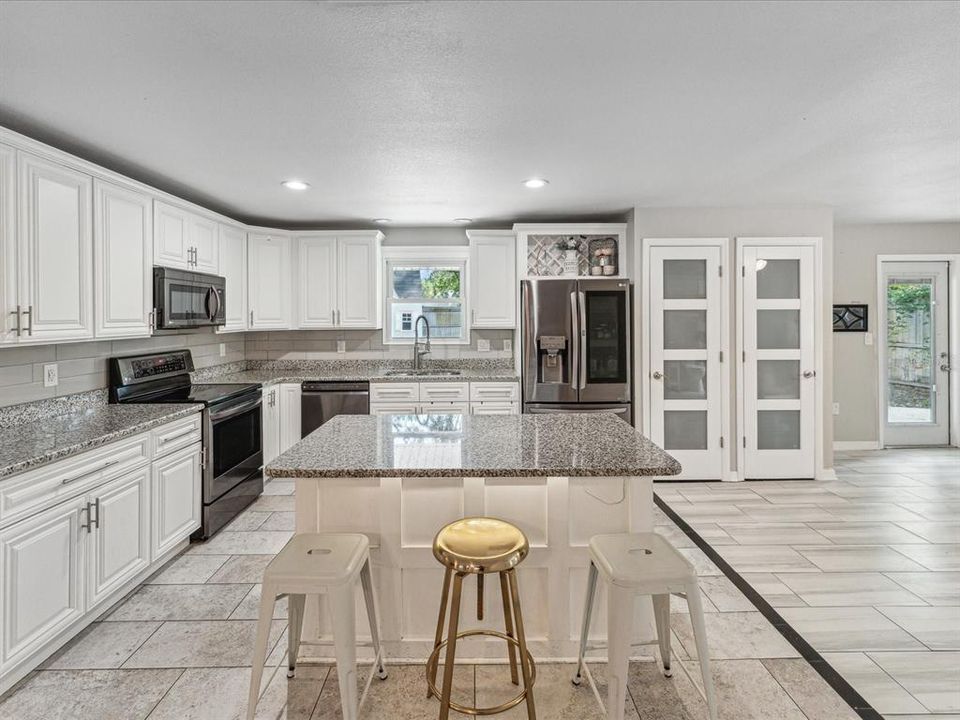 Granite countertops and stainless steel appliances make this kitchen a dream to cook and eat in!