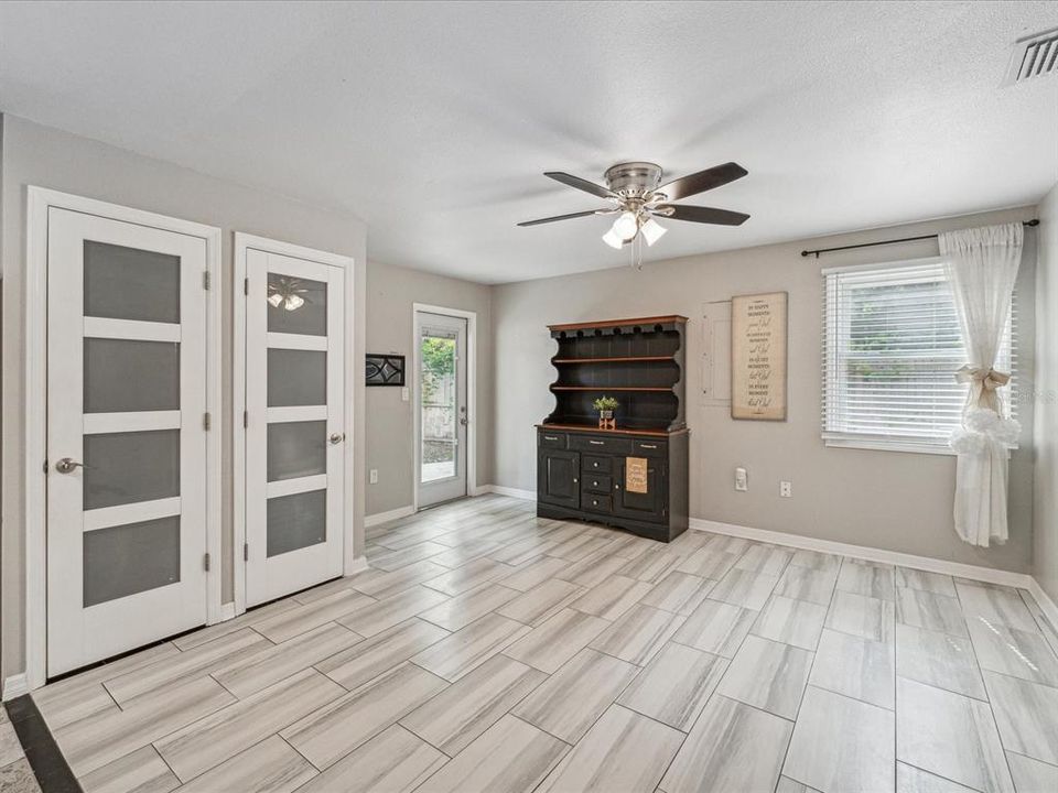 The walk-in pantry is behind the door on the left and the water heater is behind the right door.