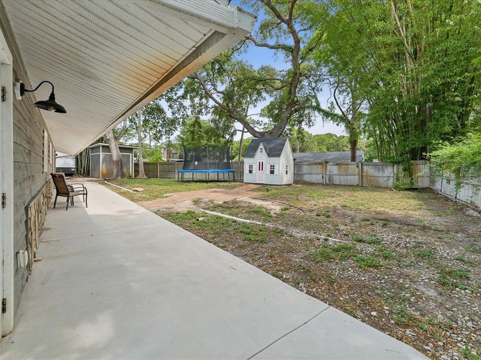 The wraparound porch is sloped to carry water away from the house.