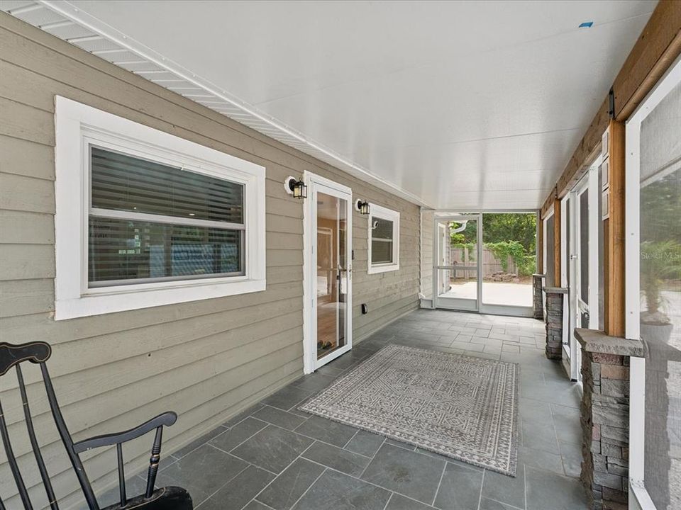 Rocking chairs are welcome in this spacious porch.