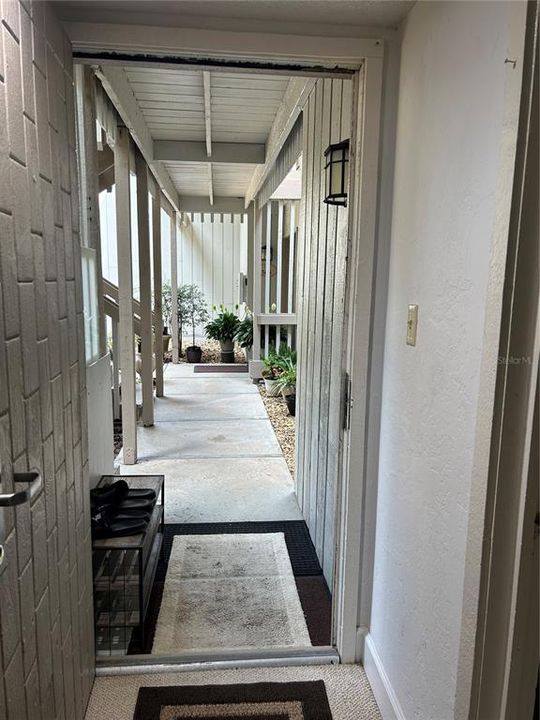 Looking out the door to the outside from the primary bedroom