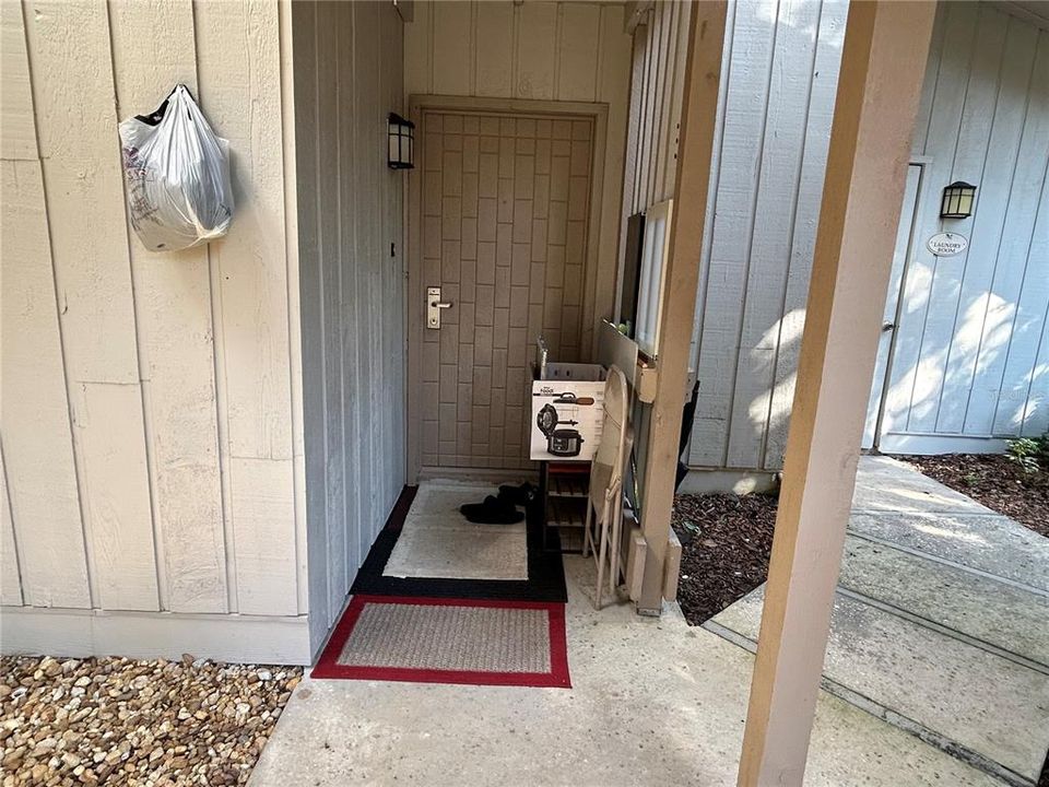 This is the second front door that leads directly into the primary suite location. And just steps to the right you will see the extremely close laundry area that is available for everyone in this building...but none closer than this address