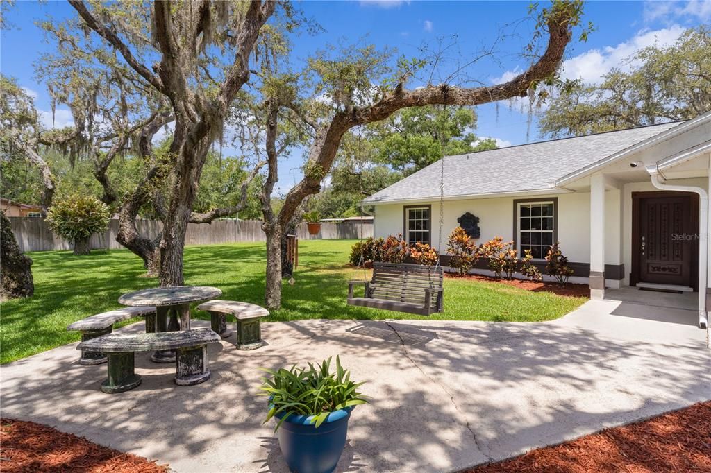 Front of Home w/swing & picnic table