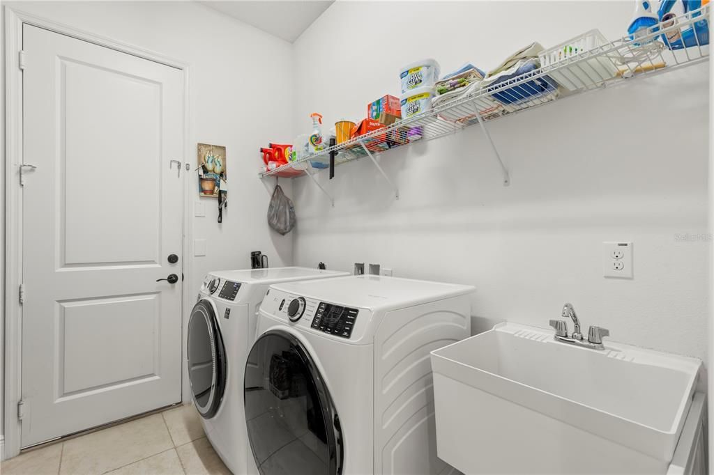 Laundry room with washer/dryer connections (gas) and sink. (Washer/Dryer not included)