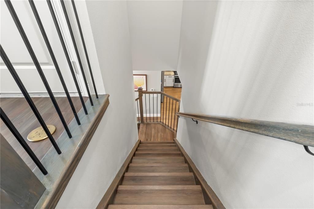 Stairs to upstairs bonus room. Luxury vinyl flooring
