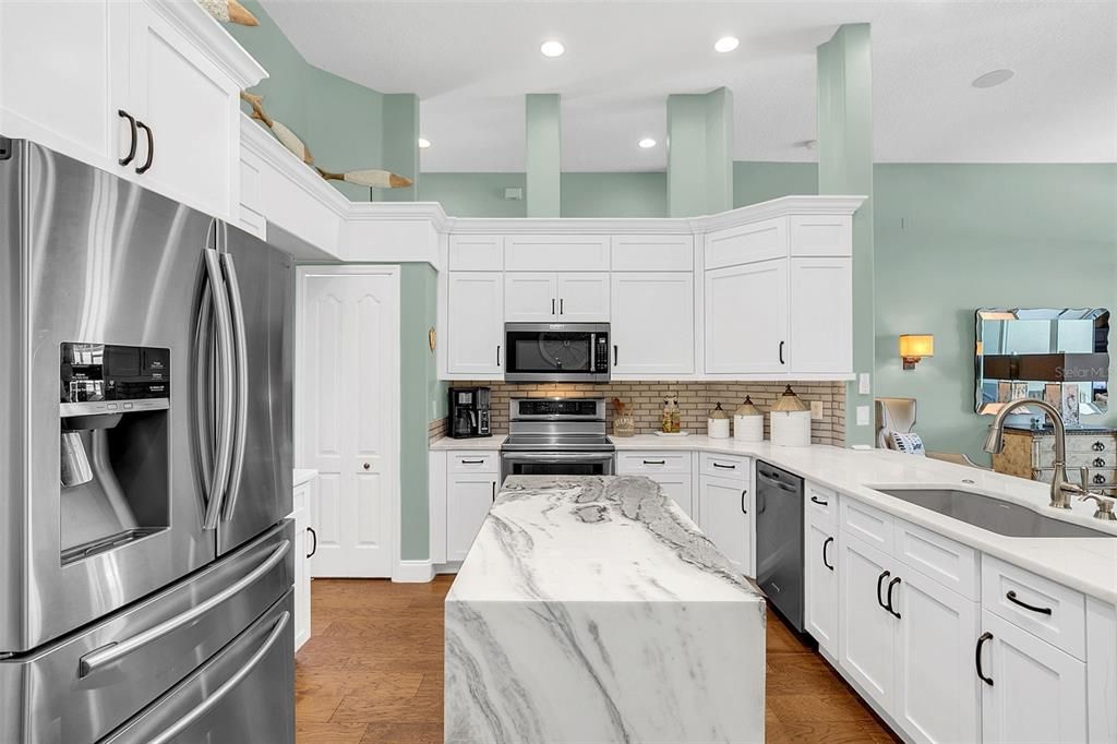 Custom Kitchen Island with Marble Waterfall Edge