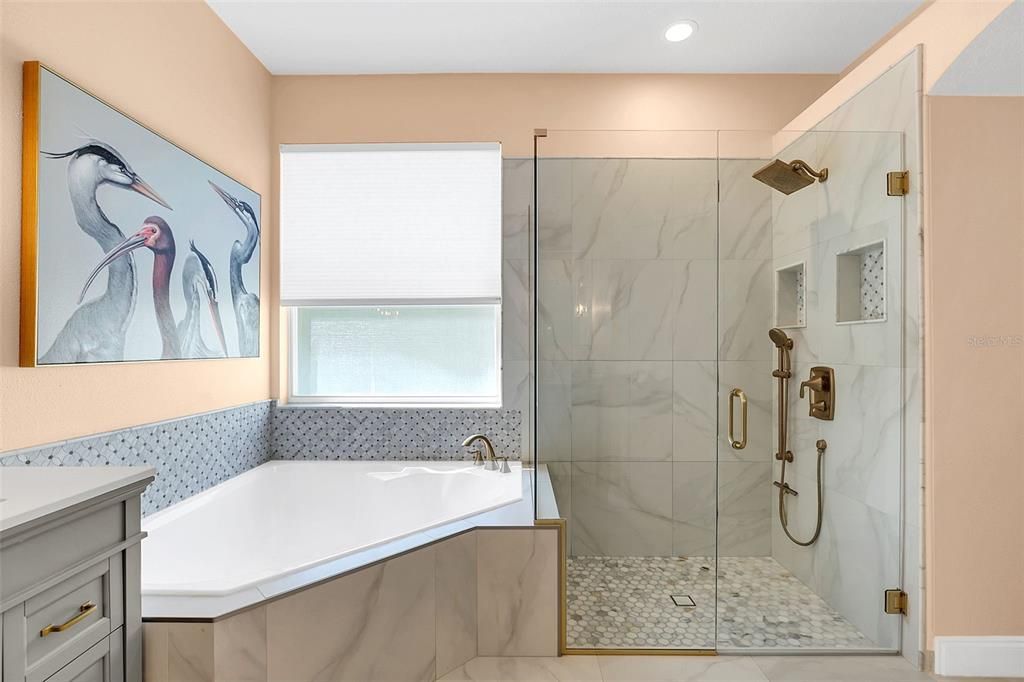 Frameless Glass Shower with Brushed Gold Fixtures