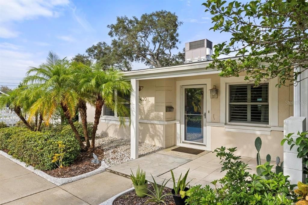 Aerial of the rear elevation showing the covered lanai and walkway.