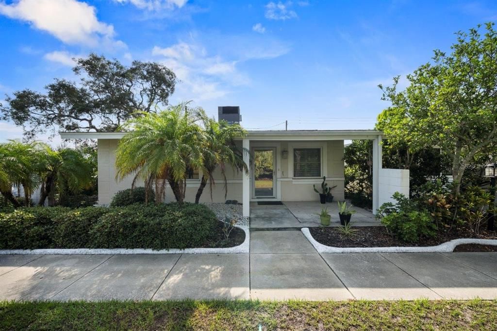 Rear elevation showing the covered lanai and door leading to the living room.