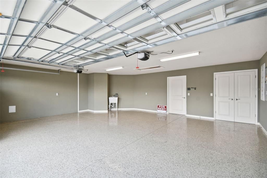 Oversized garage with epoxy floor - plenty of room for golf cart and storage