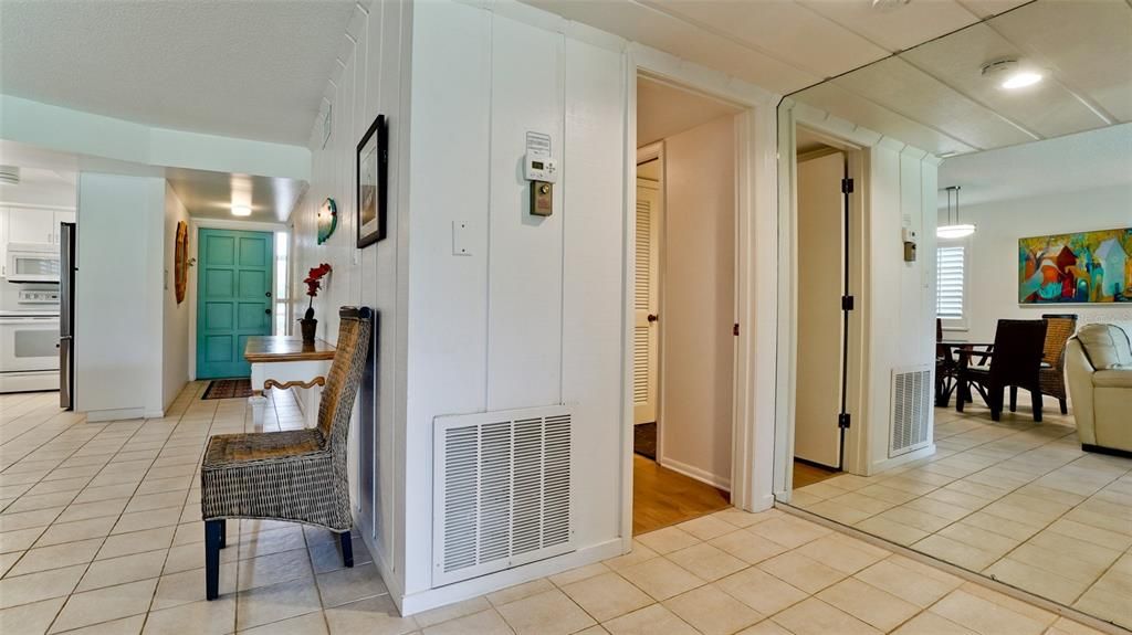 FLOOR TO CEILING MIRRORED WALL IN ALCOVE BETWEEN THE TWO BEDROOMS