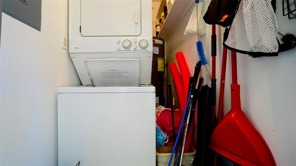 STACKABLE WASHER & DRYER IN STORAGE ROOM OFF OF ENTRY TO CONDO