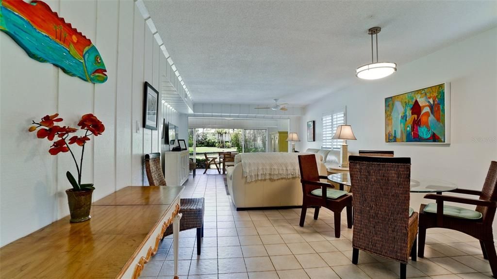 THE LIVING/DINING AREA GREAT ROOM & LANAI ARE TILED FOR EASY FLORIDA LIVING. FURNITURE IS INCLUDED IN THIS SALE.