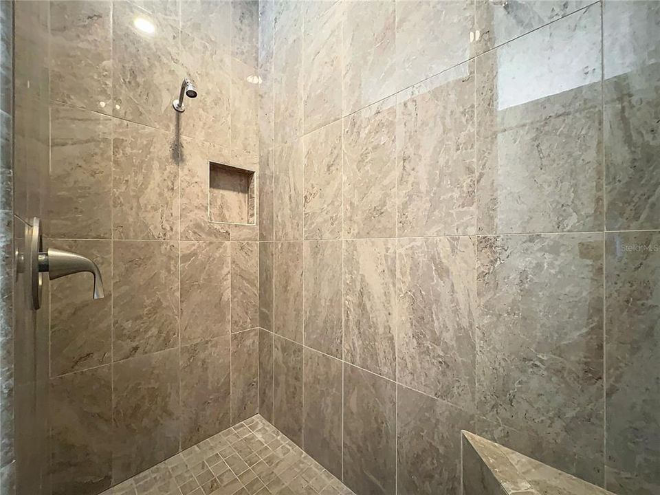 Upstairs primary shower w/bench