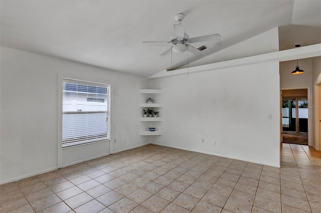 Tiled living room with vaulted ceiling