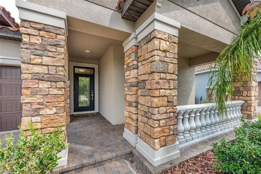 Closer look of the entrance and insulated glass front door and front porch.