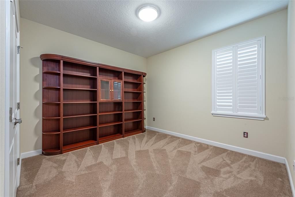 Bedroom 2 has a library wall that stays unless the buyer doesn't want it.