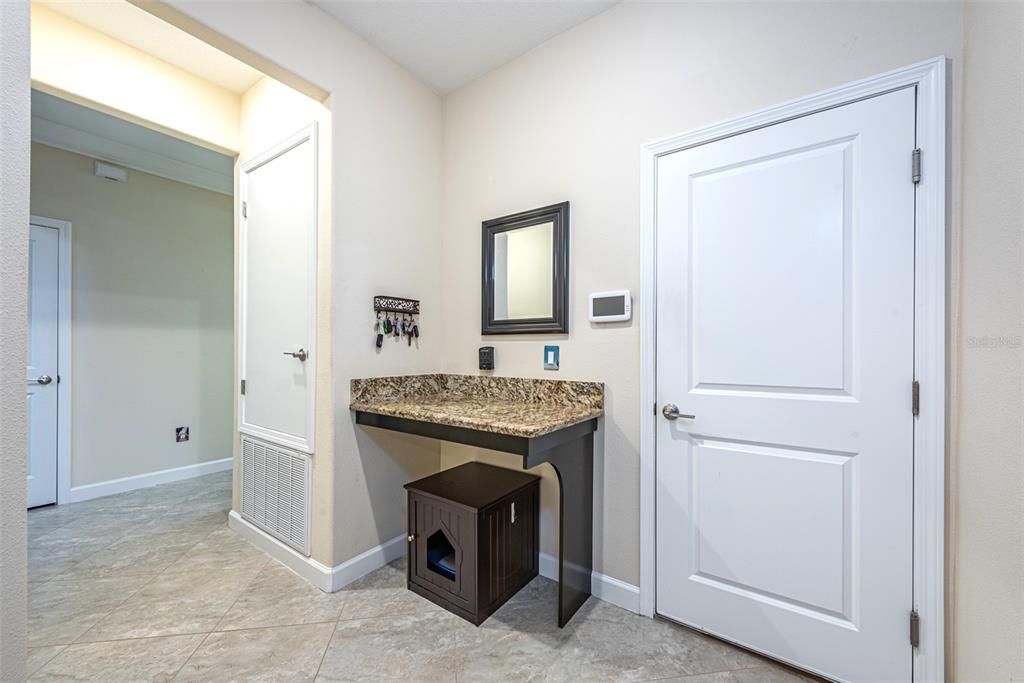 This granite counter space would make a great computer area for doing homework, or a catch-all when coming in from the garage.