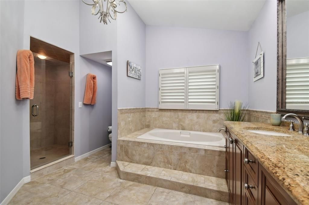 Master bath area with soaking tub and dual sinks.