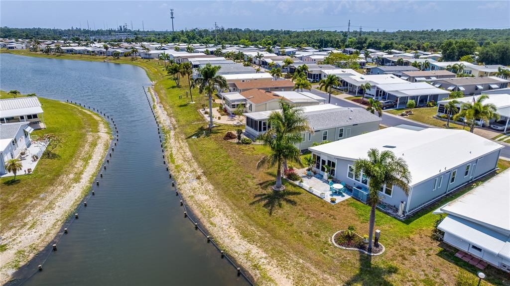 A long and lovely lake in a well manicured community.