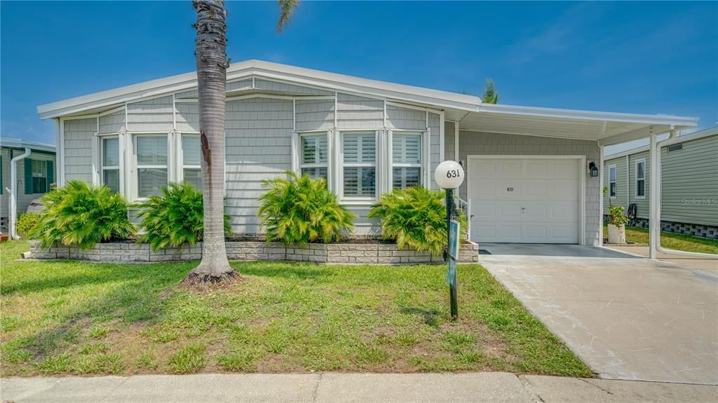 Look at the detail on the front of this lovely home! Yes; that's a garage!