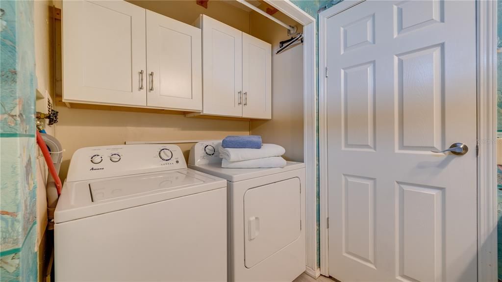 The inside laundry is neatly tucked in the guest bathroom; steps from the master and guest bedrooms.
