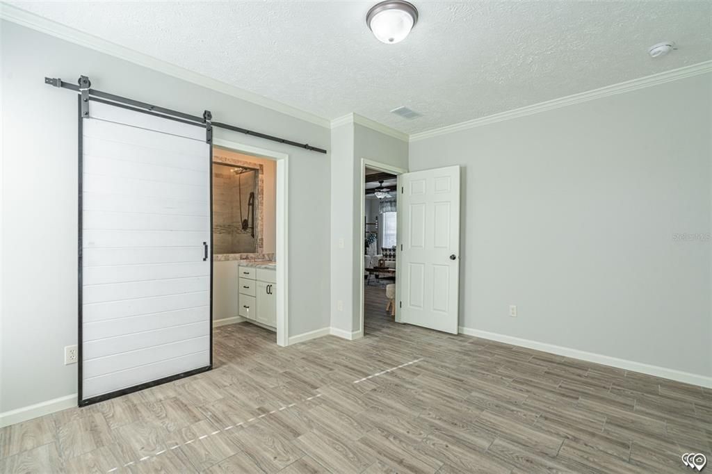 Primary bedroom towards primary  bathroom(Manufacturer Stock Photo)