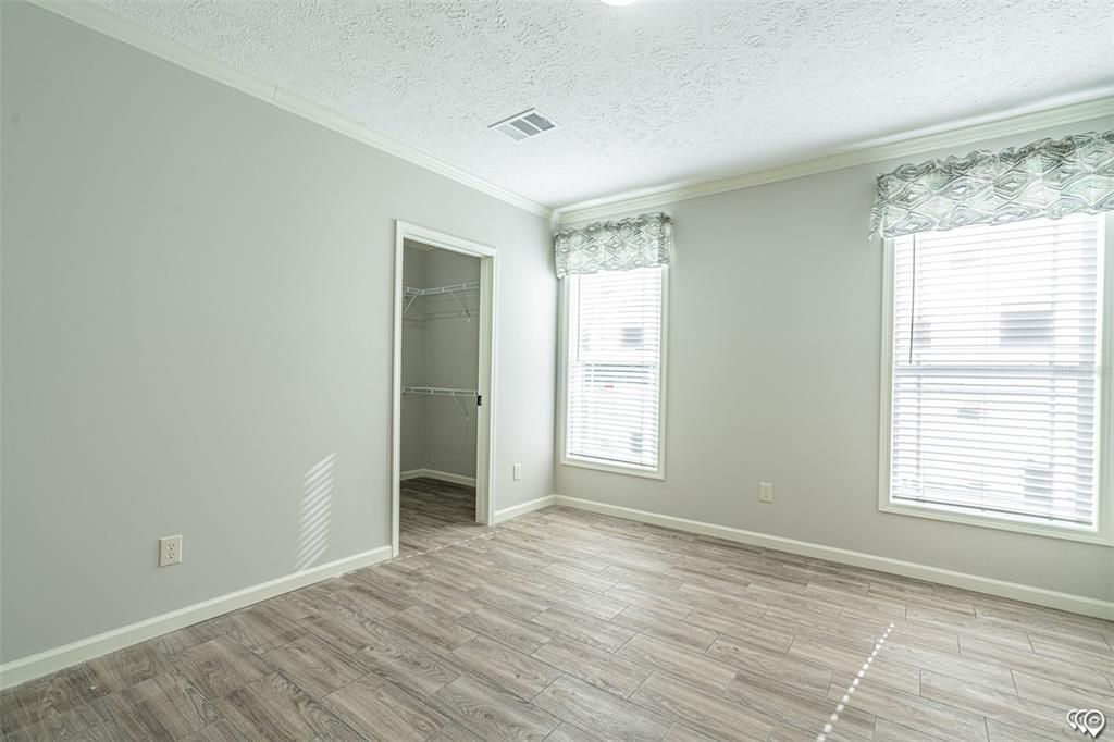 Primary bedroom towards walk-in closet(Manufacturer Stock Photo)