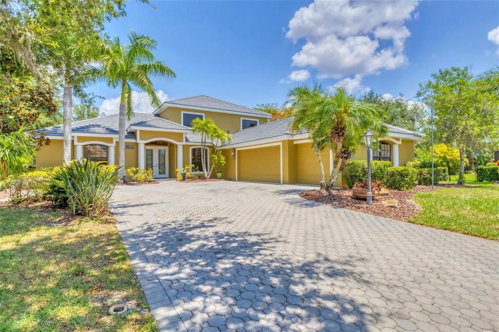 Fabulous front facade with 3 car side entry garage.